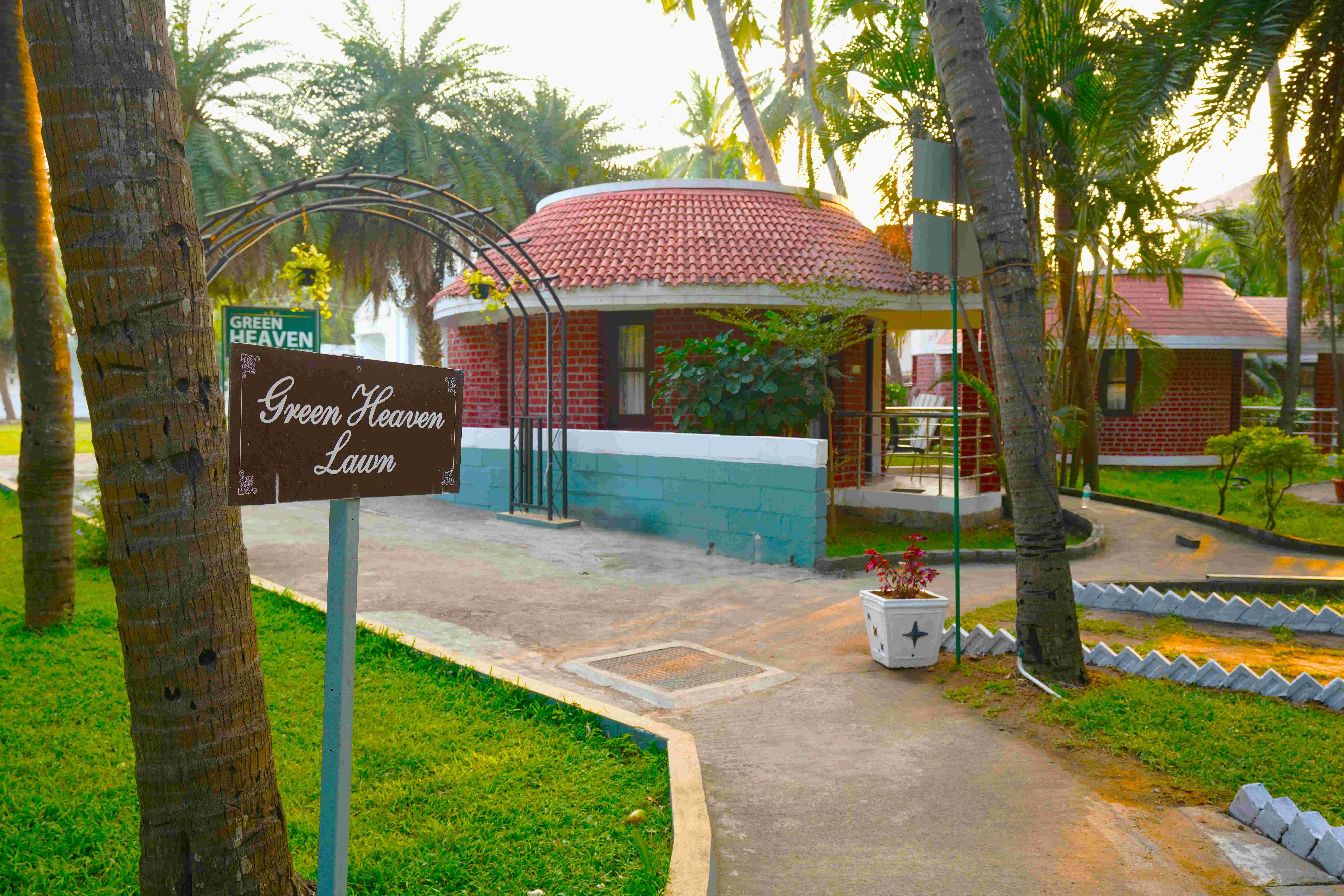 Green Coconut Resort ECR Chennai garden and outdoor seating area